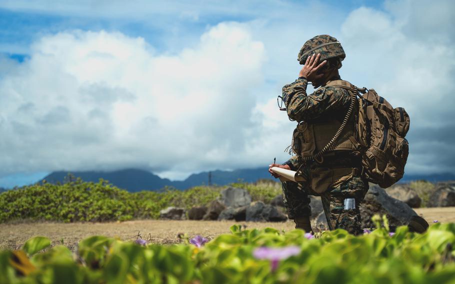 A Marine with 12th Marines, 3rd Marine Division, calls for close air support during Large-Scale Exercise 2021 at Marine Corps Base Hawaii, Aug. 11, 2021.