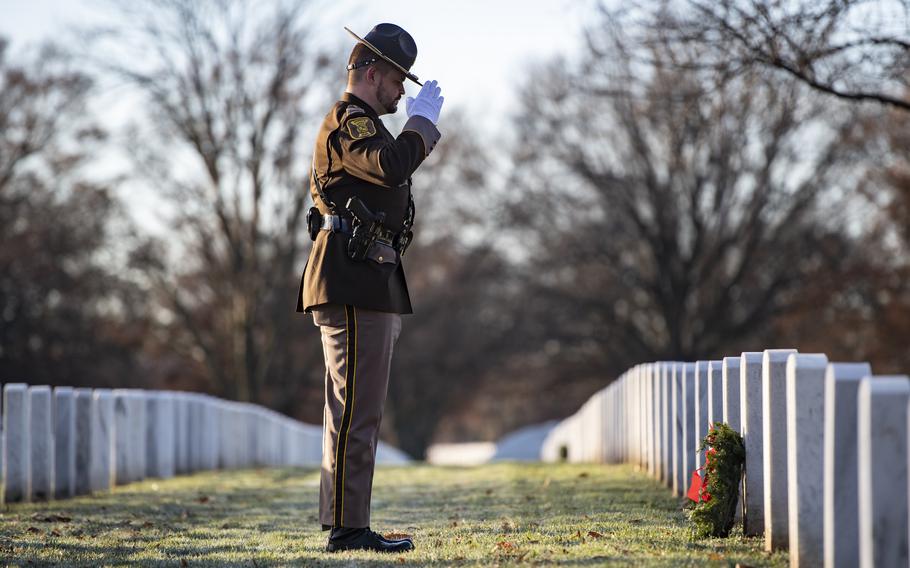Volunteers participate in the 32nd Wreaths Across America Day in Section 59 of Arlington National Cemetery, Arlington, Va., Dec. 16, 2023. 