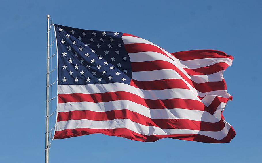 An American flag flutters in the wind.