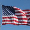 An American flag flutters in the wind.