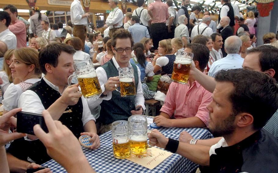 Beer flows in the tents at the Oktoberfest in Munich, Germany. German troops will fly home more than 6,000 gallons of beer and other alcoholic beverages from Afghanistan as they withdraw from the country.