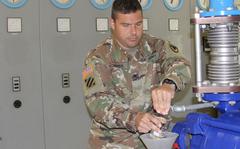 Col. Jason Edwards, then-U.S. Army Garrison Rheinland-Pfalz commander, takes a water sample at the military's Pfeffelbach Water Treatment Plant near Baumholder, Germany, in 2019. The Pfeffelbach plant operates independently from the German municipal water supply. Local officials rescinded a boil water notice for most people living off-post near Baumholder on April 19, 2022. The notice was issued after elevated levels of a harmful bacteria were found. 