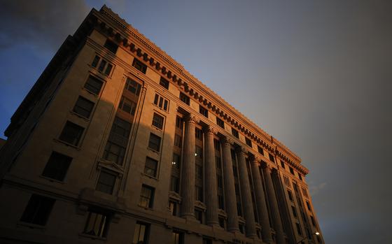 FILE - The sun sets on the Fulton County Courthouse, Monday, Aug. 14, 2023, in Atlanta. A bail bondsman charged alongside former President Donald Trump and 17 others has become the first defendant in the Georgia election interference case to accept a plea deal with prosecutors. Scott Hall pleaded guilty in court on Friday, Sept. 29, to five counts of conspiracy to commit intentional interference with performance of election duties, all misdemeanors. Prosecutors had accused him of participating in a breach of election equipment in rural Coffee County. (AP Photo/Alex Slitz, File)