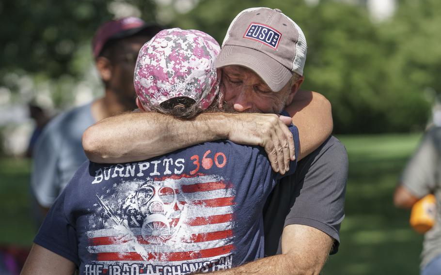 Activist and entertainer Jon Stewart hugs fellow advocate Susan Zeier of Sandusky, Ohio, just after Senate Majority Leader Chuck Schumer, D-N.Y., assured veterans and military family members that the Senate will vote on a bill designed to help millions of veterans exposed to toxic substances during their military service, at the Capitol in Washington, Tuesday, Aug. 2, 2022.