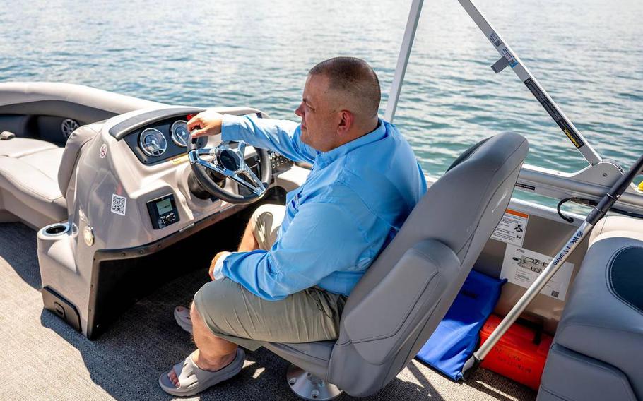 A man driving a boat.