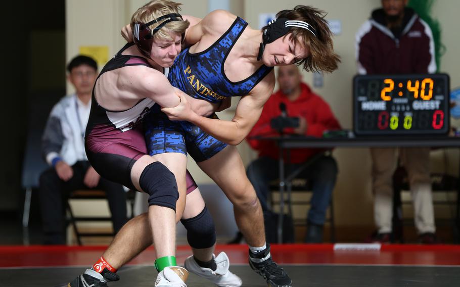 Matthew C. Perry's Kail Kitko and Yokota's Brandon Christenson battle for position at 135 pounds during Saturday's DODEA-Japan dual meet. Kitko won by decision 8-4 and Perry won the meet 39-21.