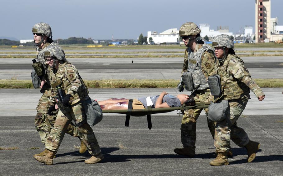 Air Force medics practice treating mass casulaties from an enemy drone strike at Yokota Air Base, Japan, Oct. 20, 2023.