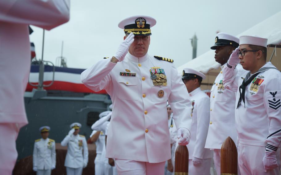Capt. Chase Sargeant departs the USS Benfold following his change of command ceremony at Yokosuka Naval Base, Japan, on Aug. 18, 2022. 