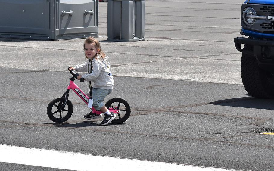 A toddler riding a bike.