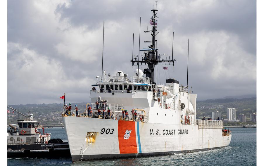 The crew of the U.S. Coast Guard Cutter Harriet Lane renders honors to the Battleship Missouri Memorial as the cutter returns to homeport in Pearl Harbor, Hawaii, April 9, 2024.