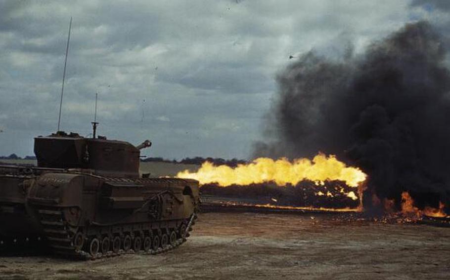 A color picture of a tank with fire coming out of a flame thrower