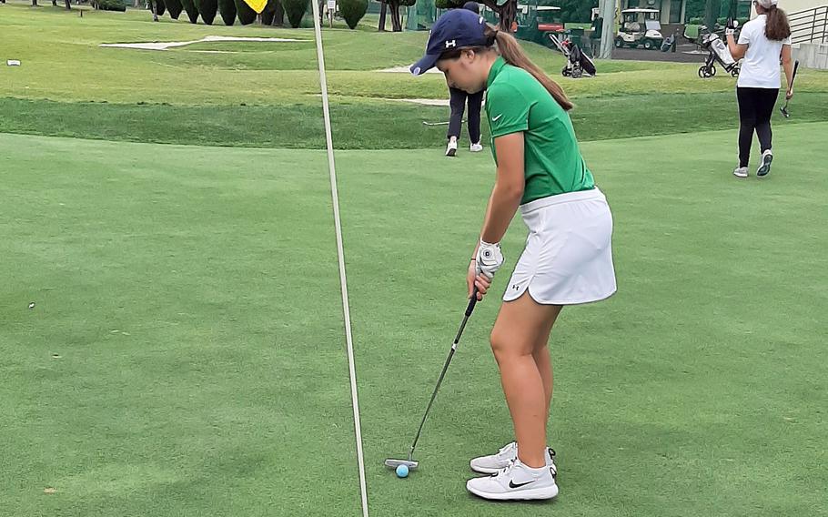 Daegu's Anna Hager lines up a putt during Wednesday's Korea golf matches. Hager won her three-player group 6 and 3 and the Warriors as a team won all four groups.