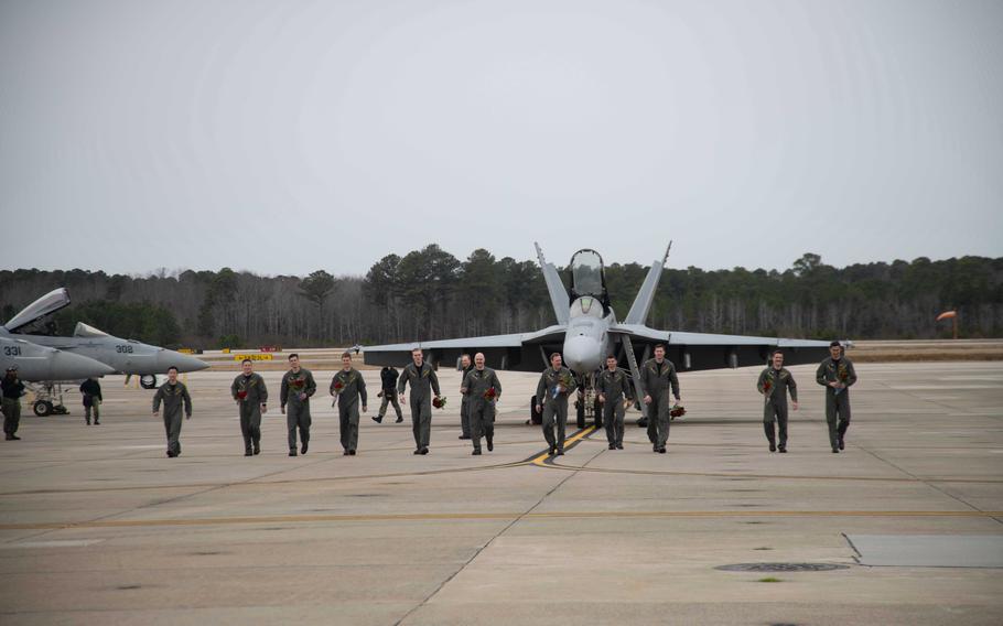 Aviators assigned to Strike Fighter Squadron (VFA) 31, “Tomcatters,” walk on the flightline after their homecoming flight to Naval Air Station Oceana, Jan. 15, 2024.