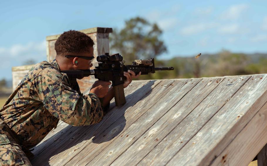 Marine Corps Lance Cpl. Luis SanchezMateo, a supply administration and operations specialist with Headquarters and Support Battalion, 3rd Marine Division, fires an M4 service rifle during the Marine Corps Marksmanship Competition Far East on Camp Hansen, Okinawa, Japan, Dec. 14, 2023. 