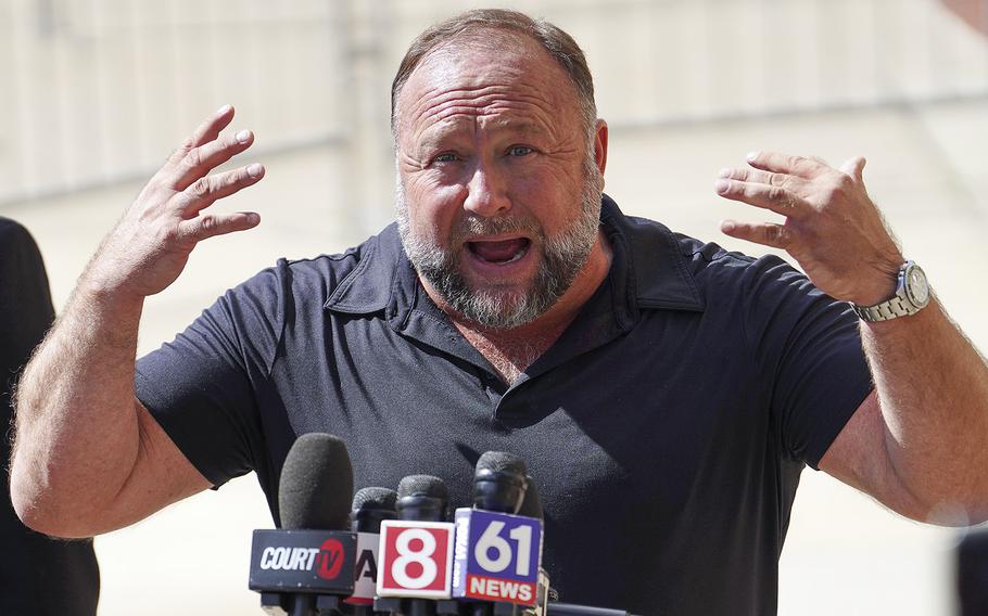 InfoWars founder Alex Jones speaks to the media outside Waterbury Superior Court during his trial on Sept. 21, 2022, in Waterbury, Connecticut.  