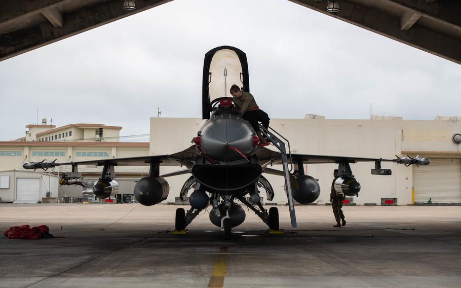 Airman 1st Class Jared Norton, 480th Expeditionary Fighter Squadron crew chief, conducts post-flight procedures on an F-16C Fighting Falcon assigned to the 52nd Fighter Wing, Spangdahlem Air Base, Germany, after it arrived at Kadena Air Base, Japan, Jan. 16, 2023. 