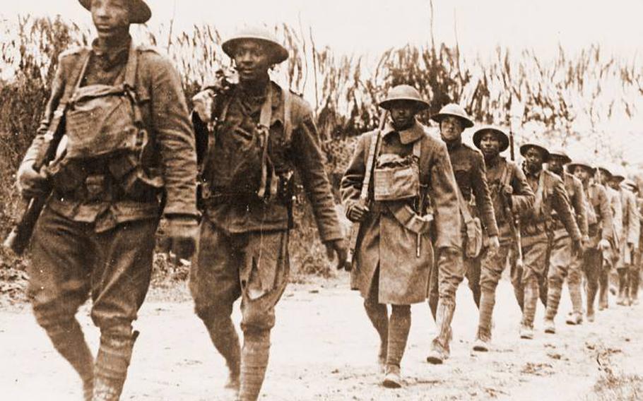 Black soldiers marching in Verdun, France, during World War I.