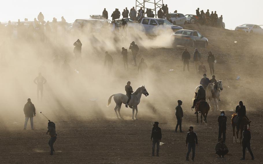 Bedouin protesters clash with Israeli forces following a protest against an afforestation project by the Jewish National Fund in the southern Israeli village of Sa’we al-Atrash in the Negev Desert, southern Israel, Thursday, Jan. 13, 2022.
