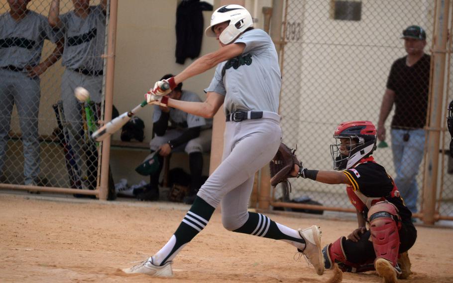 Kubasaki's Brodie Romnek connects for a double against Kadena during Monday's DODEA-Okinawa baseball game. The Dragons won 10-2.