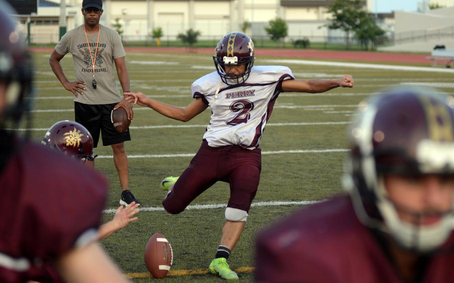 Ethan Mercado practices kicking the ball.