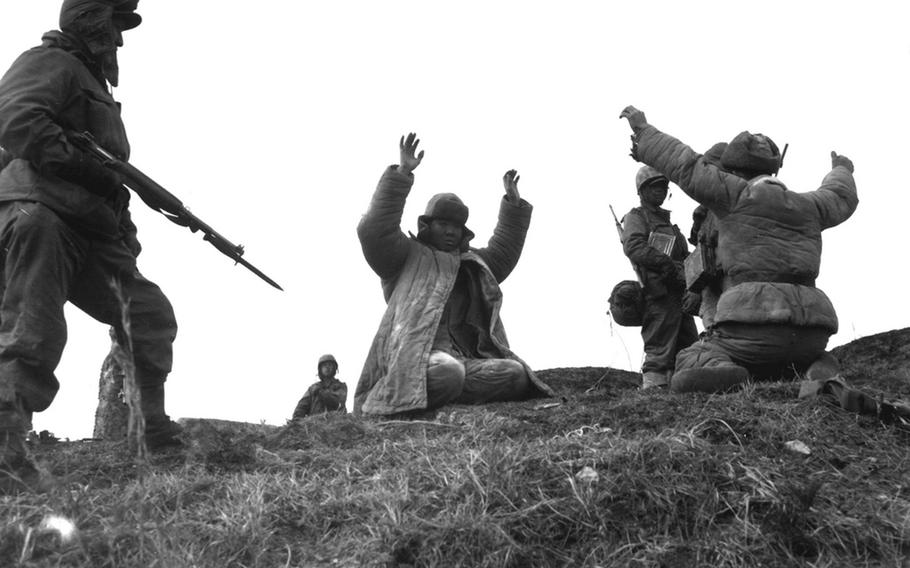 Members of the 1st Marine Division capture Chinese soldiers in Hoengsong, Korea, March 2, 1951.
