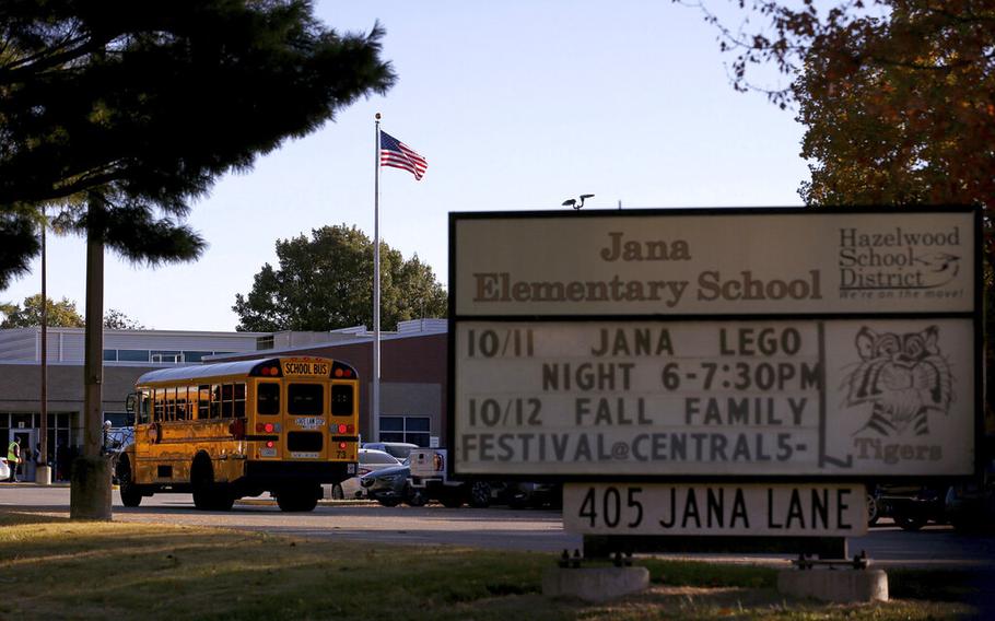 A school bus arrives at Jana Elementary School on Oct. 17, 2022, in Florissant, Mo. Another round of testing found no harmful radioactive contamination at the Missouri elementary school, leaving school board members to wonder if there really is any risk at the now-shuttered school.