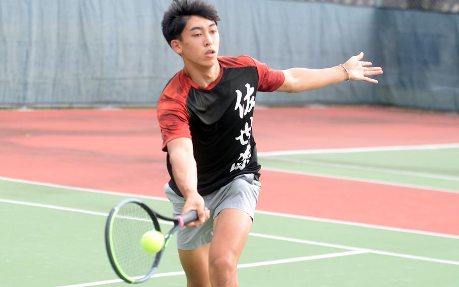 E.J. King's Kaito Bergman strikes a forehand shot against Robert D. Edgren's Charles Alvey. Bergman won 8-0.