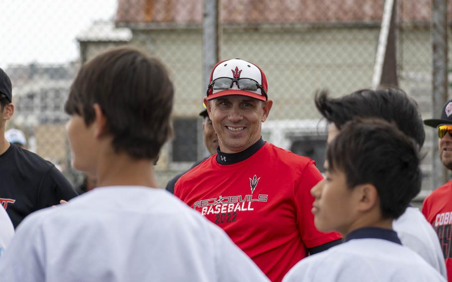 Charles Stark, baseball coach at Nile C. Kinnick High School, chats with Japanese players during a clinic at Yokosuka Naval Base, Japan, May 12, 2024.