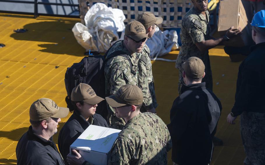 Sailors assigned to the Blue Crew of the Ohio-class ballistic-missile submarine USS Wyoming (SSBN 742) execute an exchange of command and crews at sea.