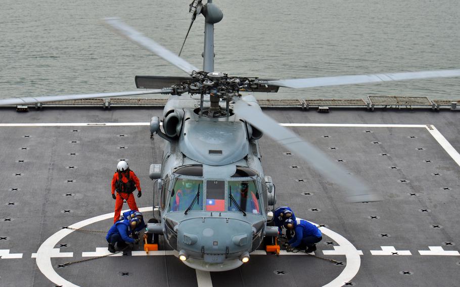 A helicopter is secured on the deck of the landing platform dock Yushan at Zuoying Naval Base, Taiwan, Jan. 12, 2023.