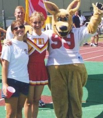 When she was a sophomore, Megan Portavoce, then known as Megan Smith, center, was a member of the VMI cheerleading team — and a target of harassment because of it. 