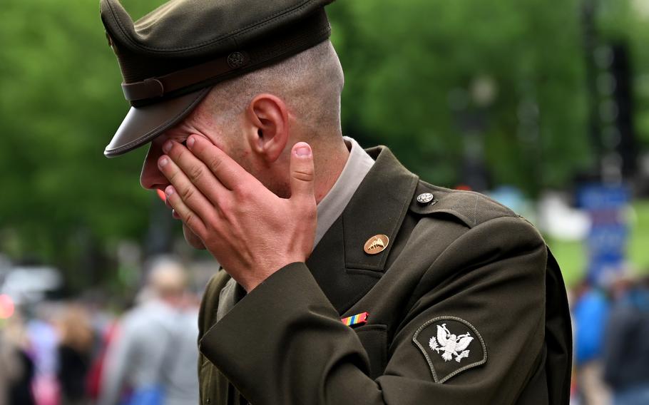 Army National Guard Spec. Joseph Wolfe of Hagerstown, Md., wipes away tears after he saluted the hundreds of motorcyclists in the Rolling to Remember demonstration in May 2021 in Washington.