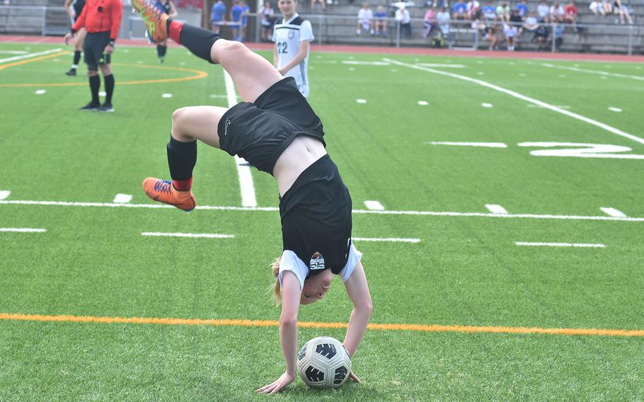 Stuttgart’s Regan Stewart, a former gymnast, did a flip while tossing in the ball late in the Panthers’ soccer victory over SHAPE on Monday, May 20, 2024. She finished second in Europe at the cross country championships and is part of a team that should dominate this season.