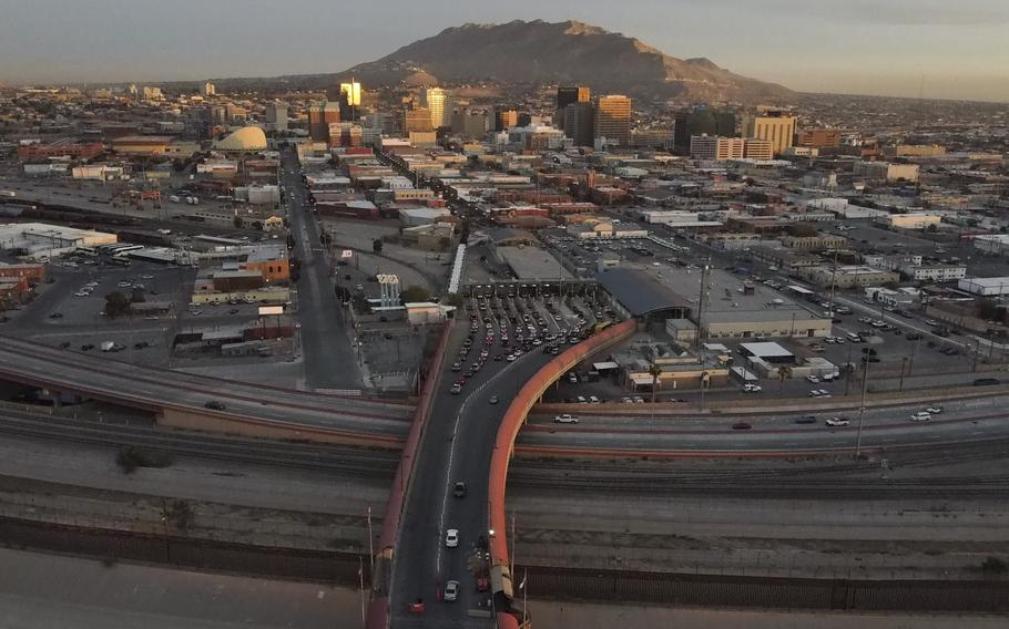 Cars line up at the Paso del Norte international bridge in Ciudad Juarez, Mexico, on the border with El Paso, Texas, top, Nov. 8, 2021. 