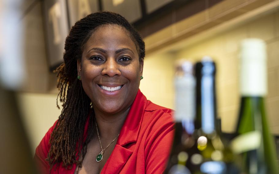 Tamara Hoggard stands for a portrait in her business, Tam'res Wine and Gourmet Shop, in Virginia Beach, Virginia on August 24, 2022.