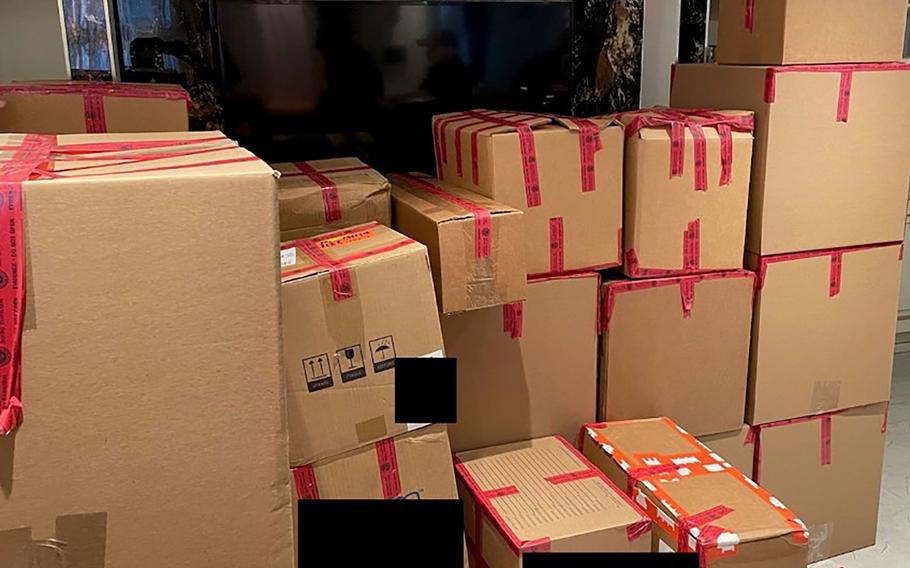 In an undated photo, packages containing electronic components intended for shipment to Russia are shown stacked in the New York apartment of Salimdzhon Nasriddinov. The components were part of a scheme to send electronics from the U.S. to Russia, which used the technology to wage war on Ukraine, federal prosecutors said.