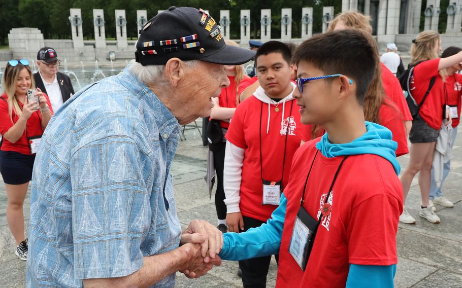 World War II veteran Les Jones chats with a student from Kenosha, Wis., at the World War II Memorial on the National Mall in Washington, D.C., on Memorial Day, May 29, 2023.