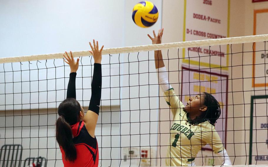Robert D. Edgren’s Nia Tyler spikes against St. Maur’s Kylie Kitaoka during Saturday’s Japan volleyball match. The Eagles won in five sets.