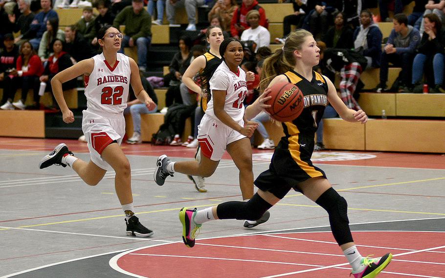 Stuttgart's Haley Wells drives to the bucket on the fastbreak as Kaiserslautern's Emma Arambula, left, and Se'maiya Farrow try to get back during Friday's game at Kaiserslautern High School in Kaiserslautern, Germany. The Panthers defeated the Raiders, 23-14.