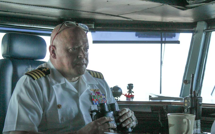 Capt. Christopher Hill sits in the bridge of the USS Dwight D. Eisenhower on Sunday, July 14, 2024. The Eisenhower returned to Naval Station Norfolk, Va., from a deployment to the Red Sea.