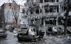 Damaged vehicles and buildings in Kharkiv city center in Ukraine, Wednesday, March 16, 2022. Both Russia and Ukraine projected optimism ahead of another scheduled round of talks Wednesday, even as Moscow's forces rained fire on Kyiv and other major cities in a bid to crush the resistance that has frustrated Kremlin hopes for a lightning victory. 