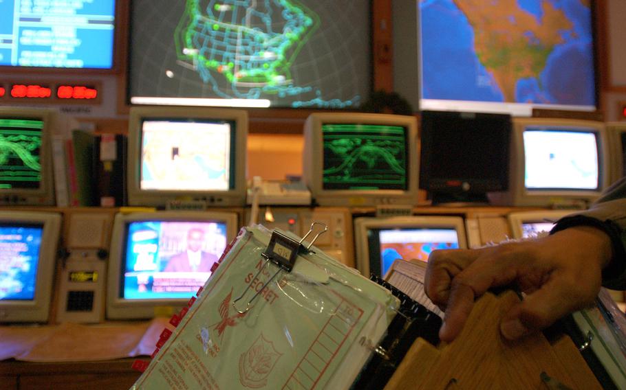 In this file photo, around-the-clock crews monitor U.S. skies from the command center of the Northern Command December 9, 2002, located deep within Cheyenne Mountain at the foot of the Rocky Mountains near Colorado Springs, Colorado. The Trump administration had decided to take the U.S. Space Command out of Colorado Springs and move the post to Huntsville, Alabama. 