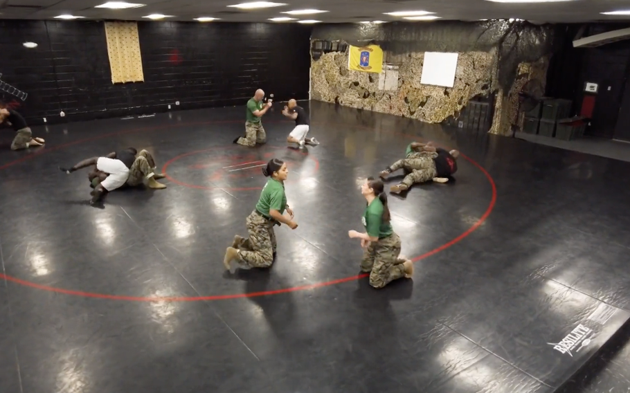 Marines practice martial arts on each other. 