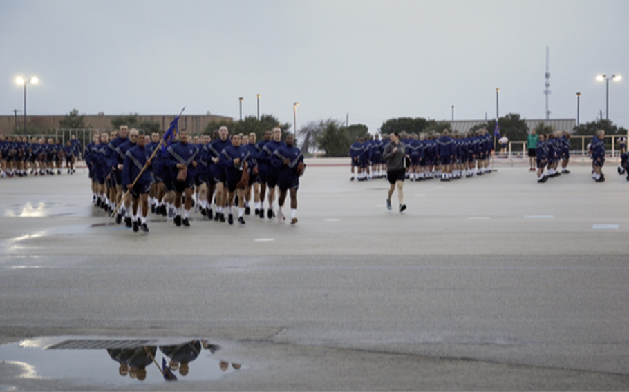 Members of the 321st Training Squadron end physical training with a formation run during the filming of the docuseries “Basic,” which will stream on the Air Force Recruiting YouTube channel beginning Thursday. The eight-episode series follows five trainees who attended training at Joint Base San Antonio-Lackland, Texas, between October 2019 and January 2020. 