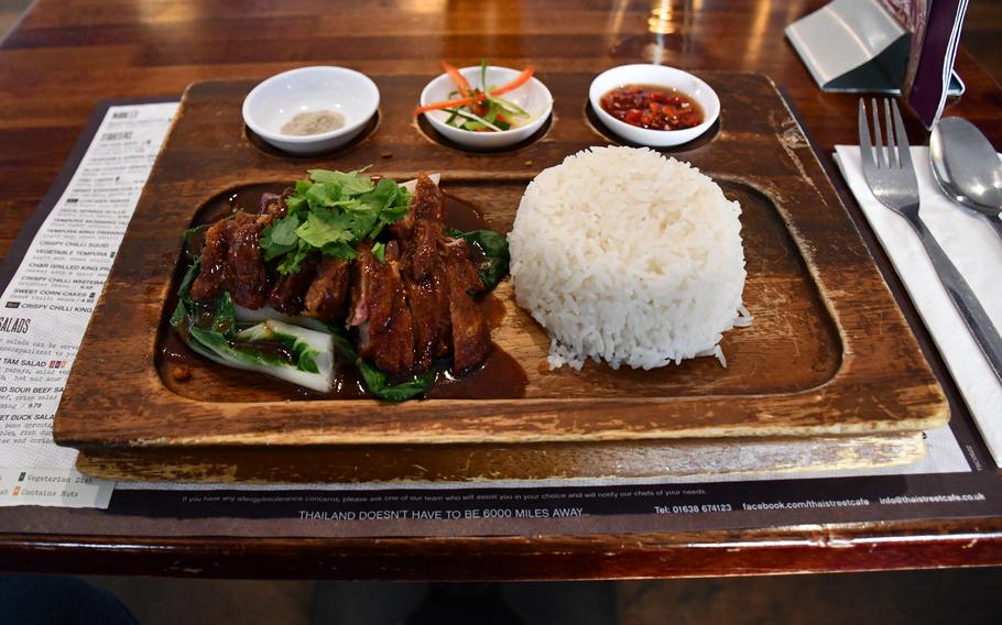 The duck board offered at the Thai Street Cafe comes with steamed bok choy, covered in a rich barbecue sauce with sides of shredded spring onion, chili vinegar and jasmine rice. 