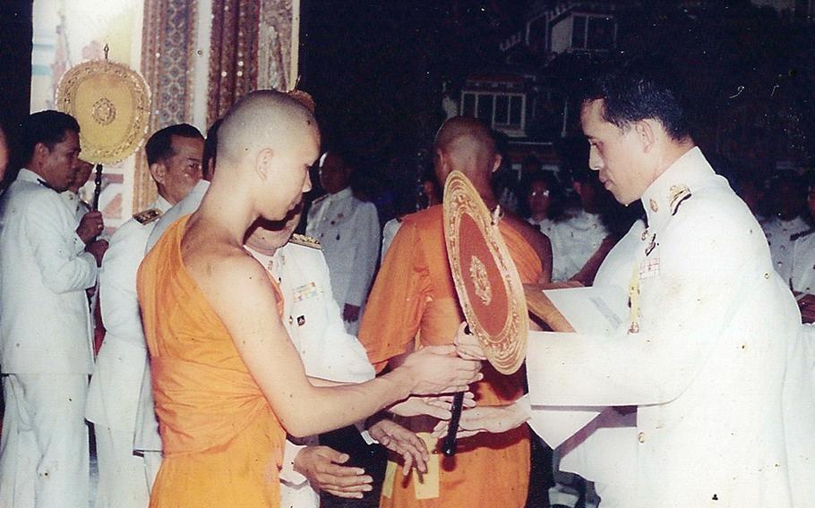 Then-Crown Prince Maha Vajiralongkorn, now King of Thailand, right, bestows Songkran Waiyaka with the sixth-level rank of accomplishment in Pali language studies in 1993.