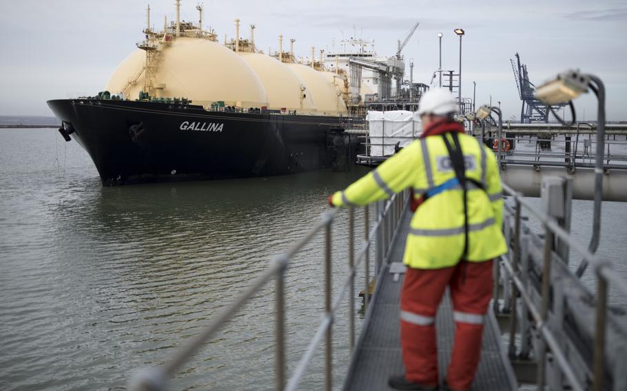 An employee looks towards the Gallina liquefied natural gas (LNG) tanker after docking at the National Grid’s Grain LNG plant on the Isle of Grain in Rochester, U.K., on March 4, 2017. 
