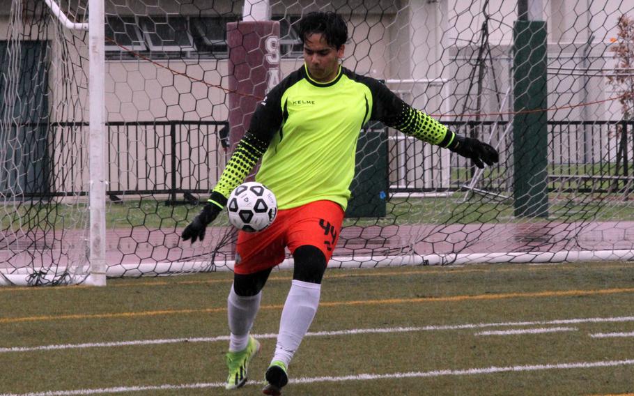 Daegu keeper Vitale Tillman punts the ball during Monday’s boys Division II soccer tournament. The Warriors lost 1-0 to Yokota and battled E.J. King to a scoreless draw.