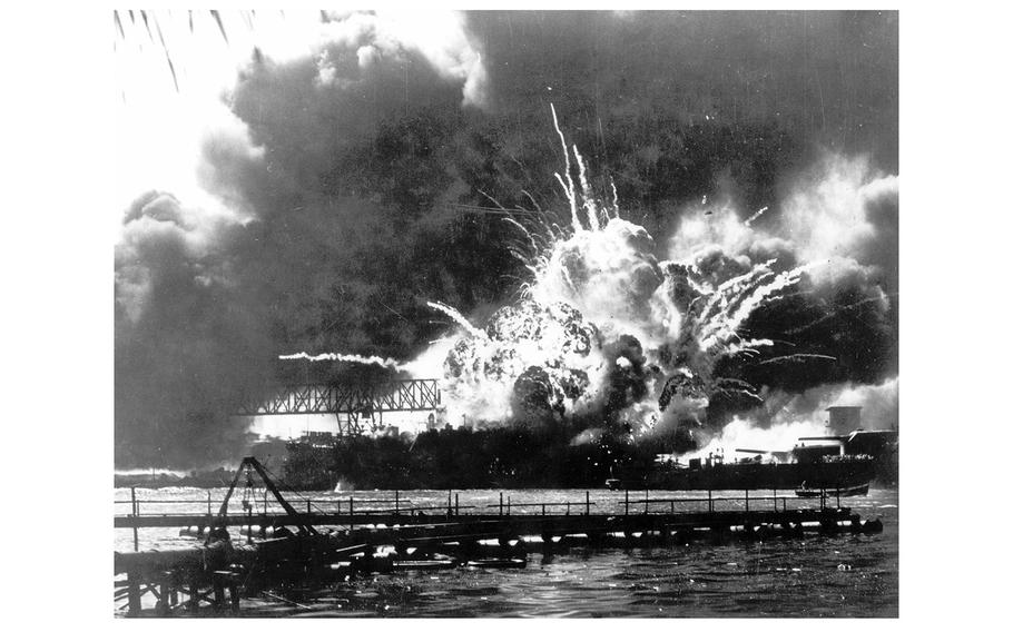 The destroyer USS Shaw explodes after being hit by bombs during the Japanese surprise attack on Pearl Harbor, Hawaii, on Dec. 7, 1941. 