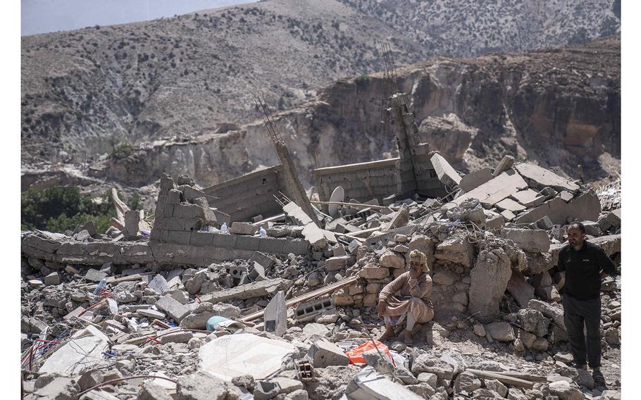 People observe the wreckage that was caused by earthquake, in the town of Imi N'tala, outside Marrakech, Morocco, on Tuesday, Sept. 12, 2023. 